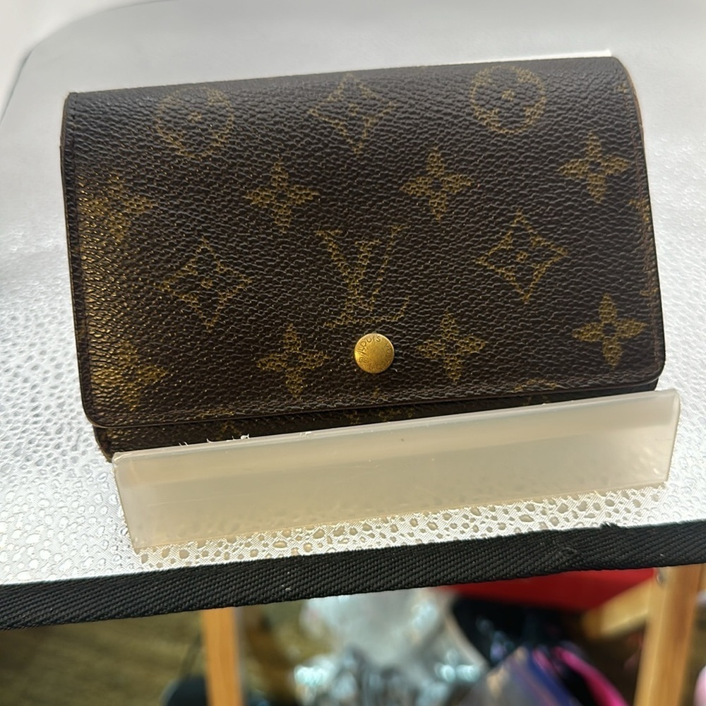 Louis Vuitton billfold. The dimensions are 6 inches wide and 4 inches. Authentic - Picture 10 of 10